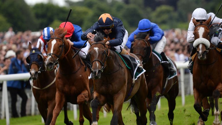 Educate ridden by Thomas Brown (centre, orange cap) wins the John Smith's Cup during the John Smith's Cup Meeting at York Racecourse. PRESS ASSOCIATION Pho