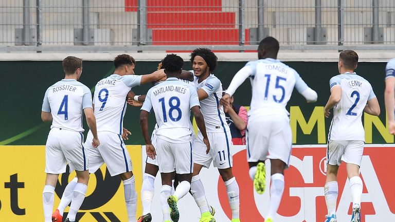 Joshua Onomah of England (hidden) celebrates his team's first goal with during the 2016 UEFA Under19 European Championship game against France