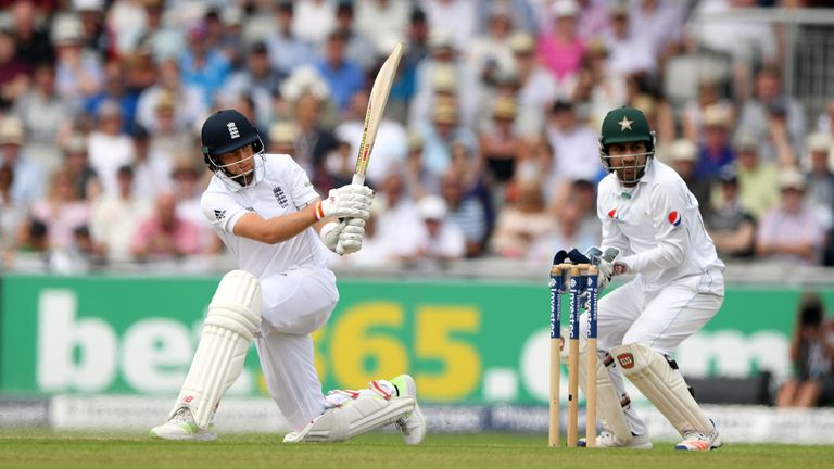 England batsman Joe Root sweeps to pick up some runs watched by Sarfraz Ahmed during day two of the 2nd Investec Test match