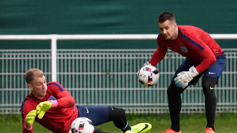 England's goalkeepers Joe Hart (L) and Tom Heaton attend a training session at the Bourgogne stadium in Chantilly on June 26, 2016, during the Euro 2016 fo