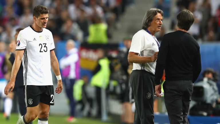 BORDEAUX, FRANCE - JULY 02:  Injured Mario Gomez of Germany walks off the pitch next to Joachim Loew (R), head coach of Germany and Hans-Wilhelm Mueller-Wo