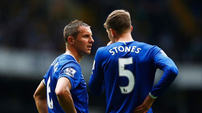LONDON, ENGLAND - AUGUST 29: Phil Jagielka (L) and John Stones (R) of Everton talk during the Barclays Premier League match between Tottenham Hotspur and E