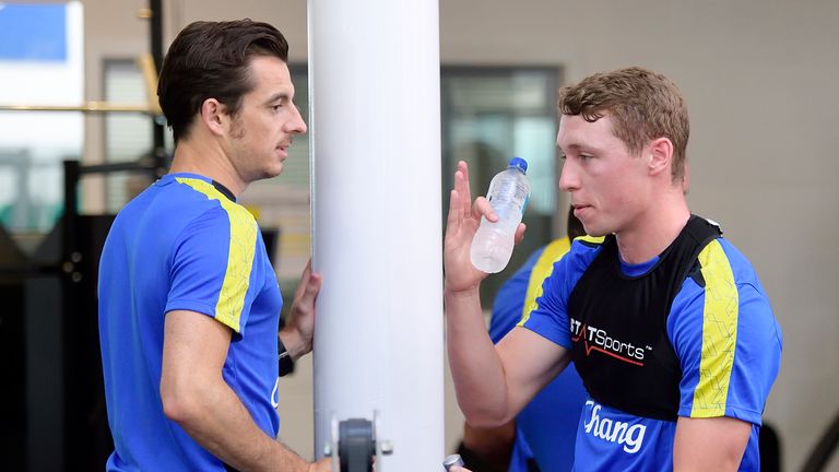 Leighton Baines and Matthew Pennington take a breather during pre-season training with Everton at Finch Farm