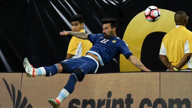 Ezequiel Lavezzi suffered a broken elbow after a nasty fall over the billboard playing for Argentina