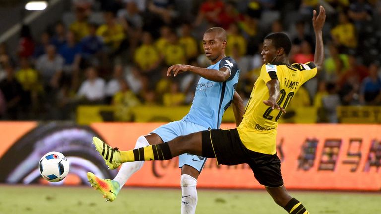 Borussia Dortmund's Adrian Ramos (R) fights for the ball with Manchester City's Fernando Luiz Roza during the 2016 International Champions Cup football mat