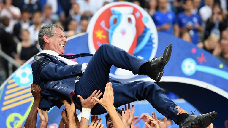 PARIS, FRANCE - JULY 10:  Fernando Santos manager of Portugal is thrown into the air by his players after his side win 1-0 against France during the UEFA E