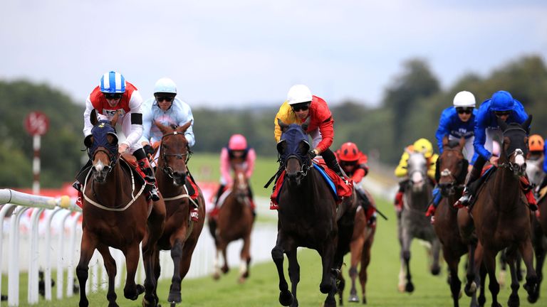 Fire Fighting, ridden by jockey Adam Kirby, on the way to winning the Matchbook Betting Exchange Stakes at Glorious Goodwood