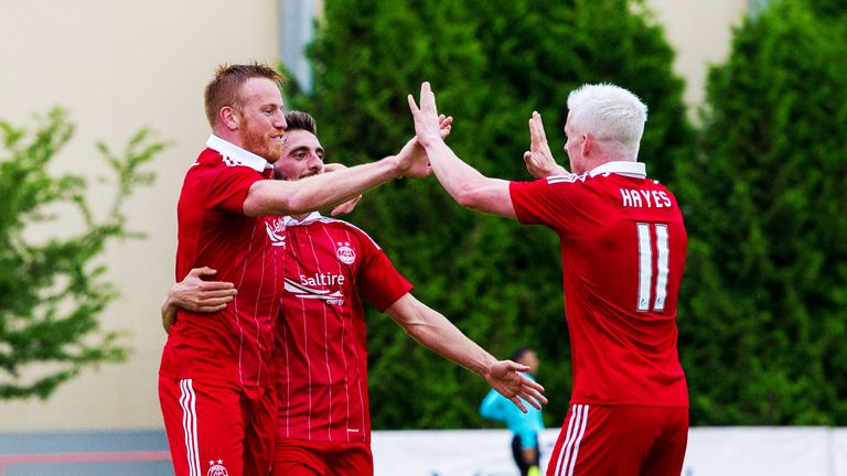 Aberdeen's Adam Rooney (left) celebrates with his team mates Graeme Shinnie and Jonny Hayes