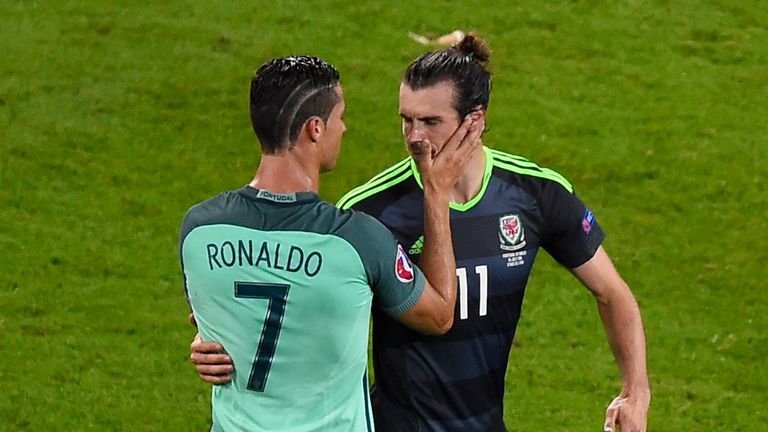 Portugal's forward Cristiano Ronaldo (L) comforts Wales' forward Gareth Bale after the Euro 2016 semi-final football match between Portugal and Wales at th