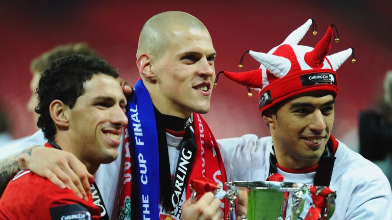 LONDON, ENGLAND - FEBRUARY 26:  Maxi Rodriguez, Martin Skrtel and Luis Suarez of Liverpool celebrate with the trophy after victory in the Carling Cup Final