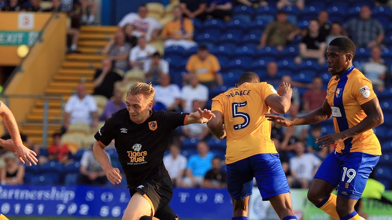 MANSFIELD, ENGLAND - JULY 19:  Krystian Pearce (C) of Mansfield Town tackles Jarrod Bowen (L) of Hull City during the pre-season friendly match between Man