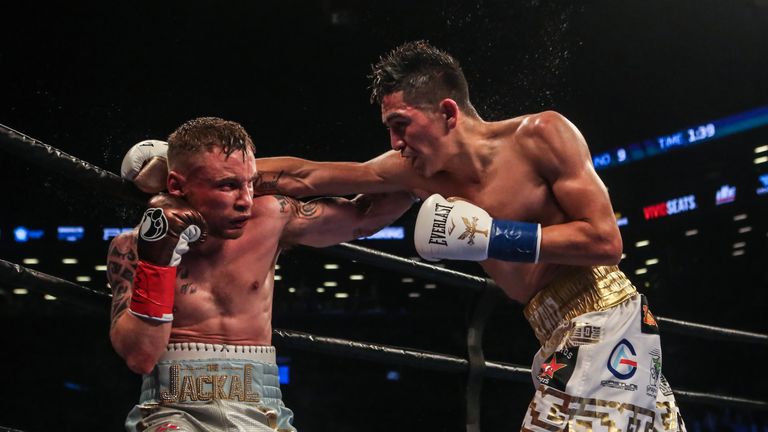 NEW YORK, NY - JULY 30:  Leo Santa Cruz of Mexico (gold trunks) fights Carl Frampton of Northern Ireland (blue trunks) during their  12 round WBA Super  fe