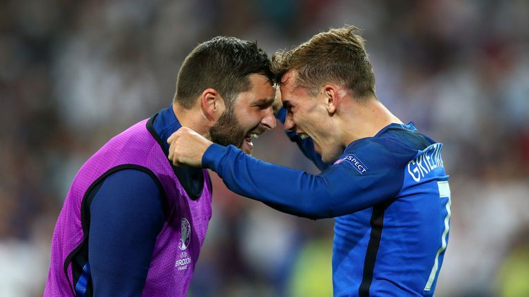 Antoine Griezmann of France celebrates scoring his team's second goal with Andre-Pierre Gignac 