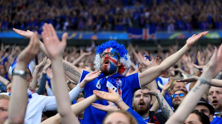 Iceland fans show their support in the stands before the game 