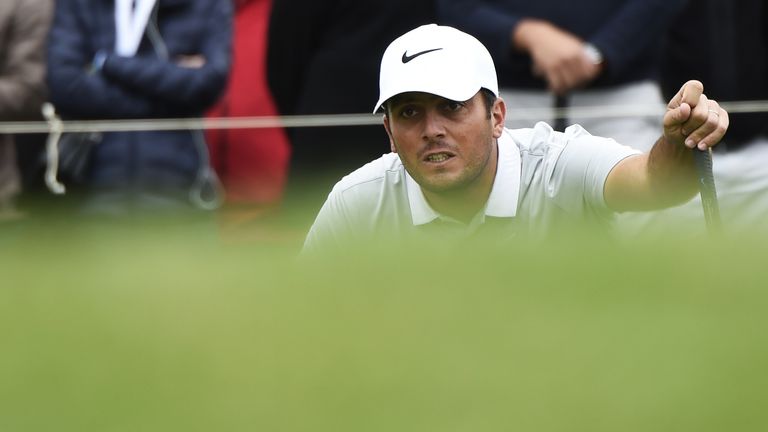 Italy's Francesco Molinari lines up a putt on the third green during the last round of the 100th French Golf Open on July 3, 2016 at Le Golf National in Gu