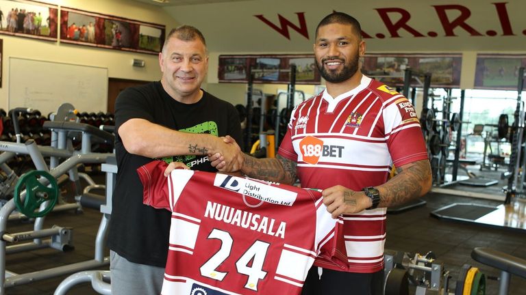 Wigan coach Shaun Wane (L) welcomes new signing Frank-Paul Nuuausala to the club