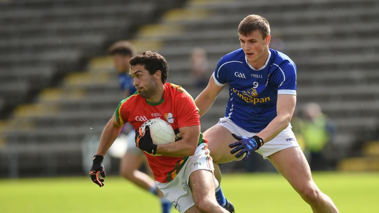 Brendan Kavanagh is tracked by Cavan's Tomas Corr