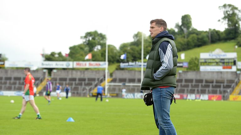 Brendan Murphy watches his team-mates warm up before their match with Cavan