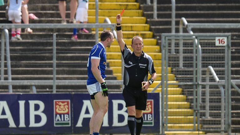 Feargal Flanagan of Cavan is shown a red card by referee Eddie Kinsella 