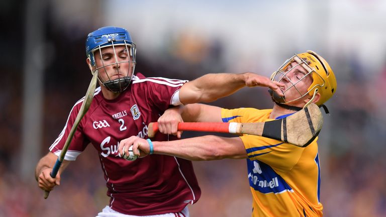 Colm Galvin of Clare in action against Johnny Coen of Galway 
