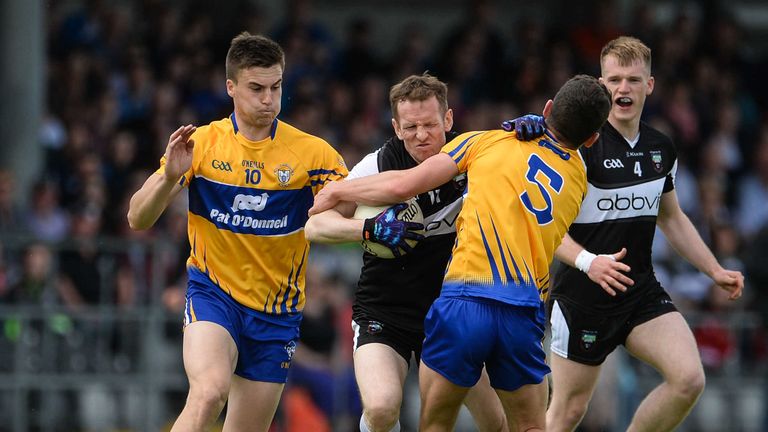 Sligo's Mark Breheny in action against Cian O'Dea of Clare