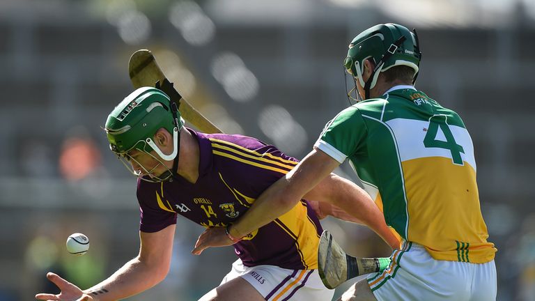 Conor McDonald in action against Paddy Rigney of Offaly