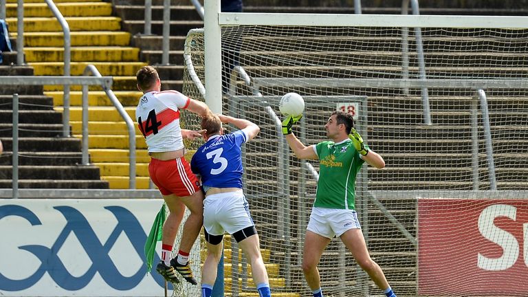 Emmett McGuckin of Derry scores his side's first goal against Cavan 