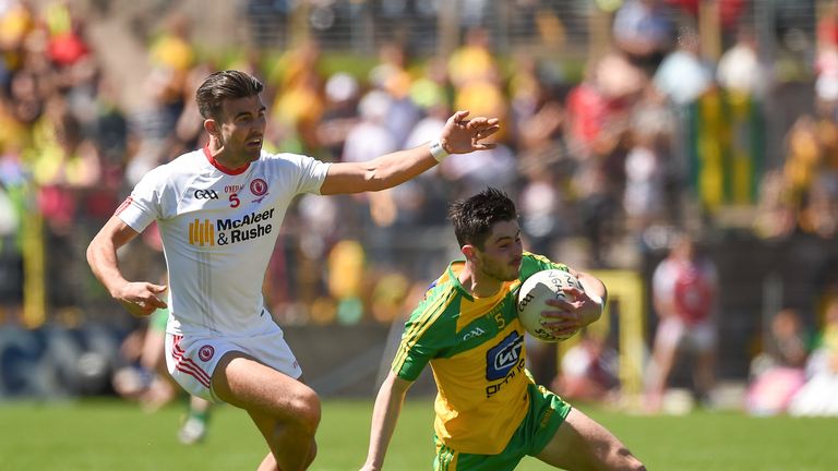 Ryan McHugh of Donegal in action against Tiernan McCann of Tyrone