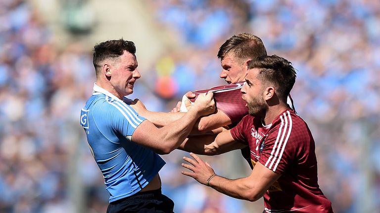 Dublin's Philly McMahon tussles with John Heslin and Paul Sharry of Westmeath 