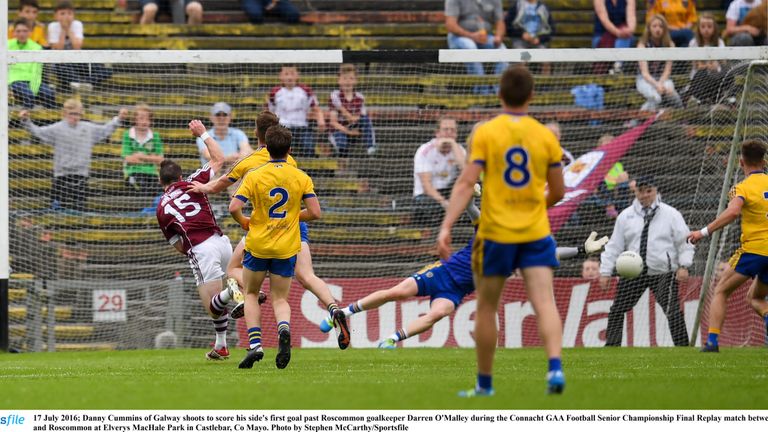 Danny Cummins of Galway shoots to score his side's first goal past Roscommon goalkeeper Darren O'Malley 