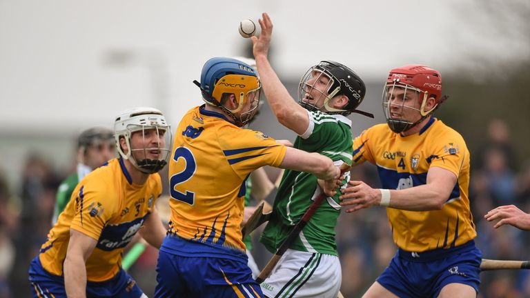Graeme Mulcahy in action against the Clare full-back line of Patrick O'Connor, Oisin O'Brien and Paul Flanagan during the 2016 National League