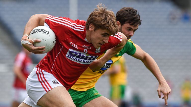 Ian Maguire is tracked by Donegal's Odhrán Mac Niallais