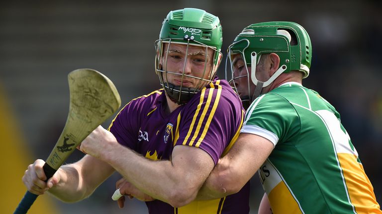 Matthew O'Hanlon is tackled by Joe Bergin of Offaly