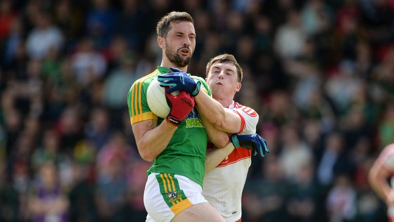 Mickey Newman is tackled by Gareth McKinless of Derry