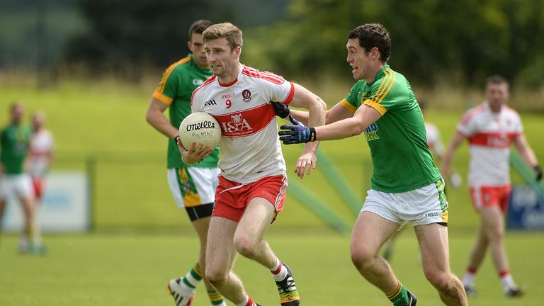 Niall Holly in action against Padraic Harnan of Meath