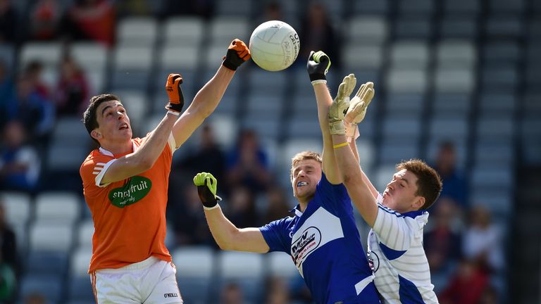 Rory Grugan scores a goal despite the efforts of Laois' Mark Timmons and Graham Brody