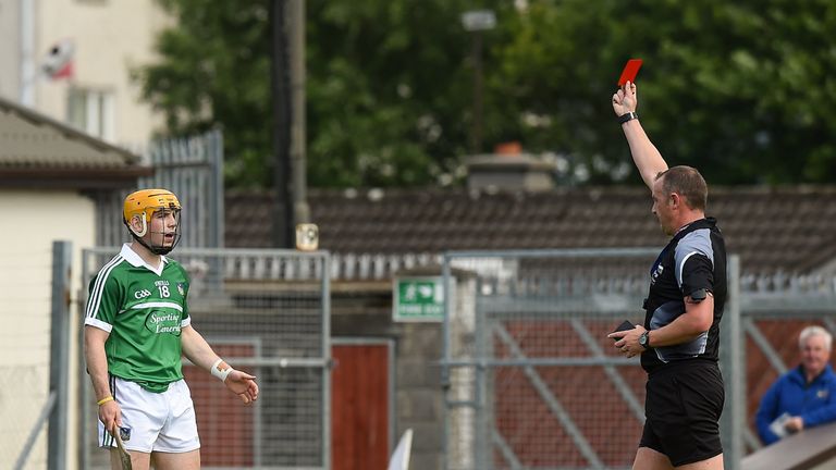 Seanie O'Brien is shown a red card by referee Alan Kelly