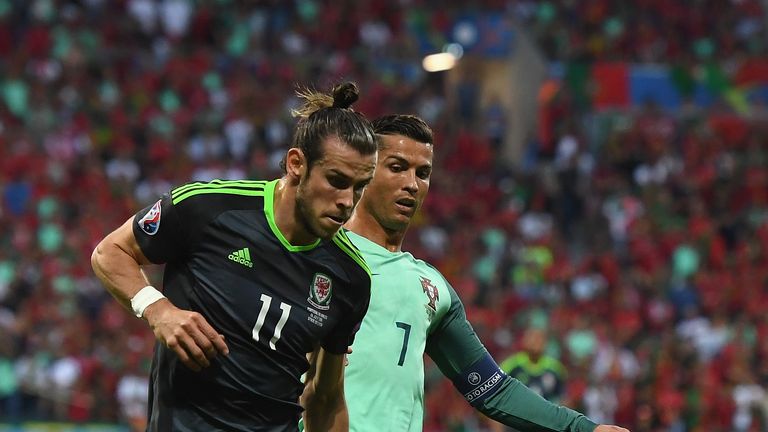 Gareth Bale of Wales and Cristiano Ronaldo of Portugal compete for the ball during the UEFA EURO 2016 semi final match in Lyon