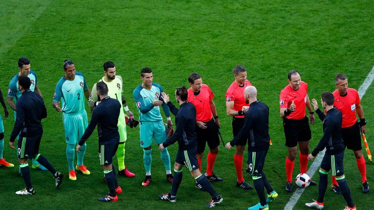 Cristiano Ronaldo of Portugal and Gareth Bale of Wales shake hands prior to the UEFA EURO 2016 semi final match in Lyon