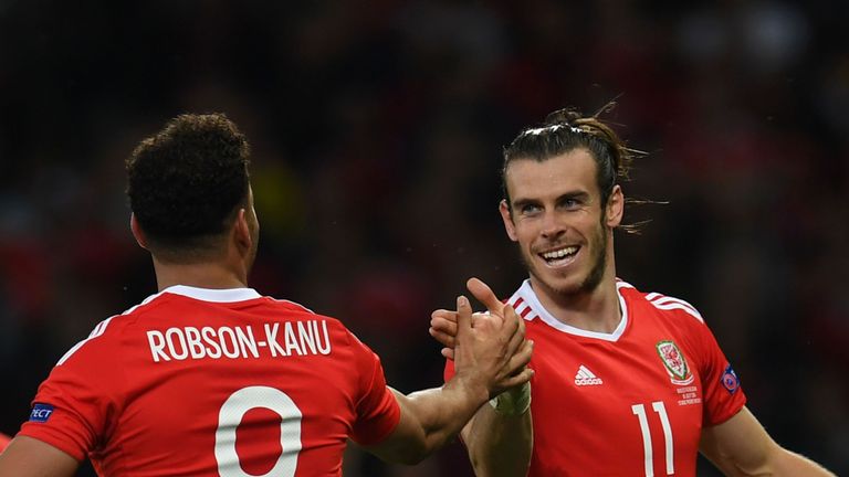Wales' forward Hal Robson-Kanu (L) celebrates after scoring a goal with Wales' forward Gareth Bale (R) during the Euro 2016 quarter-final football match be