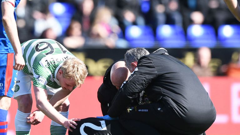 Celtic winger Gary Mackay-Steven offers comfort to Dean Brill after his injury