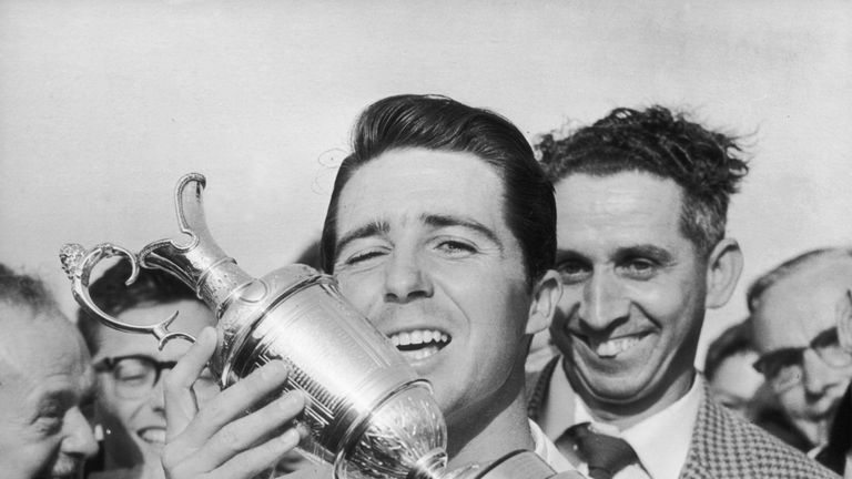 4th July 1959:  South African golfer Gary Player holds his trophy aloft after winning the British Open at Muirfield in Scotland