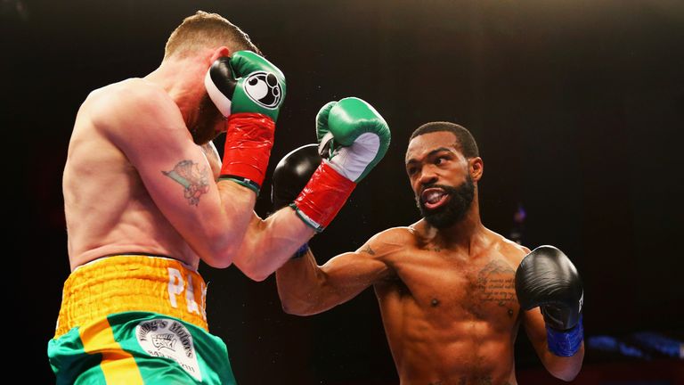MASHANTUCKET, CT - APRIL 16: Gary Russell Jr. lands a right at Patrick Hyland during their WBC World Featherweight Championship bout at Foxwoods Resort Cas