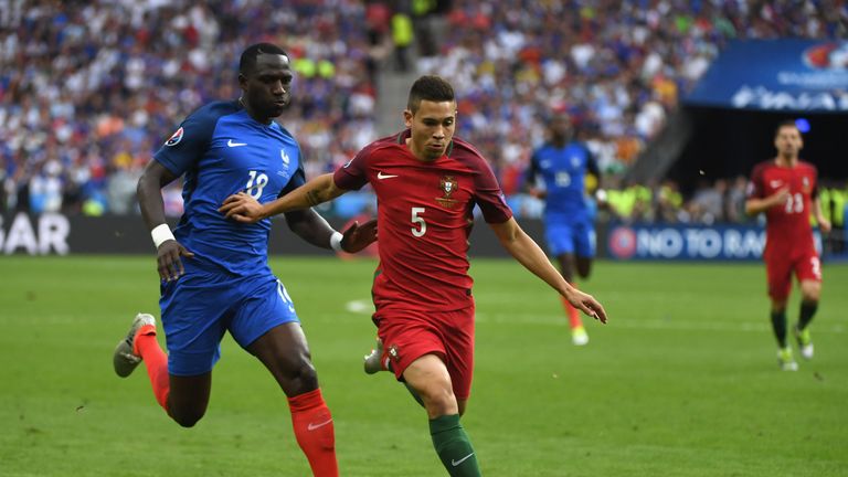 PARIS, FRANCE - JULY 10: Raphael Guerreiro of Portugal controls the ball under pressure of Moussa Sissoko of France during the UEFA EURO 2016 Final match b