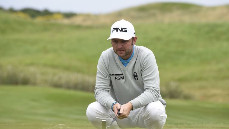 Britain's Andy Sullivan looks on after lining up a putt on the third green during the last round of the 100th French Golf Open on July 3, 2016 at Le Golf N