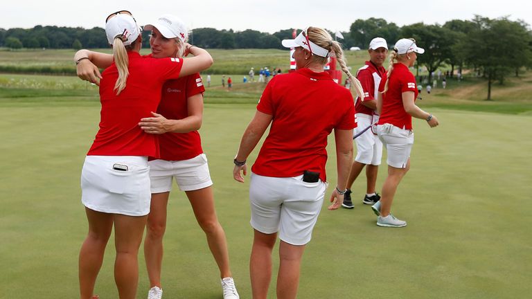 England celebrate on the 17th green after defeating Thailand