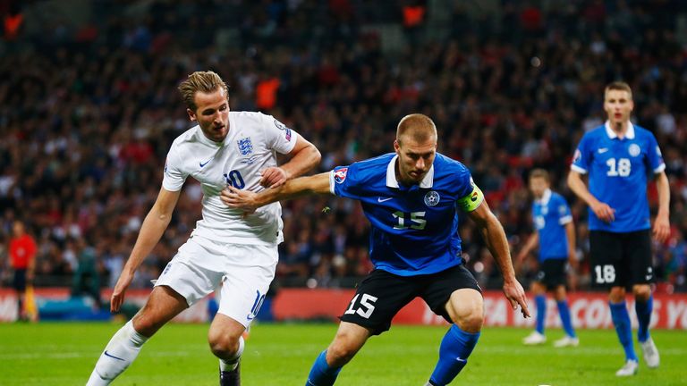 LONDON, ENGLAND - OCTOBER 09:  Ragnar Klavan of Estonia holds off Harry Kane of England during the UEFA EURO 2016 Group E qualifying match between England 