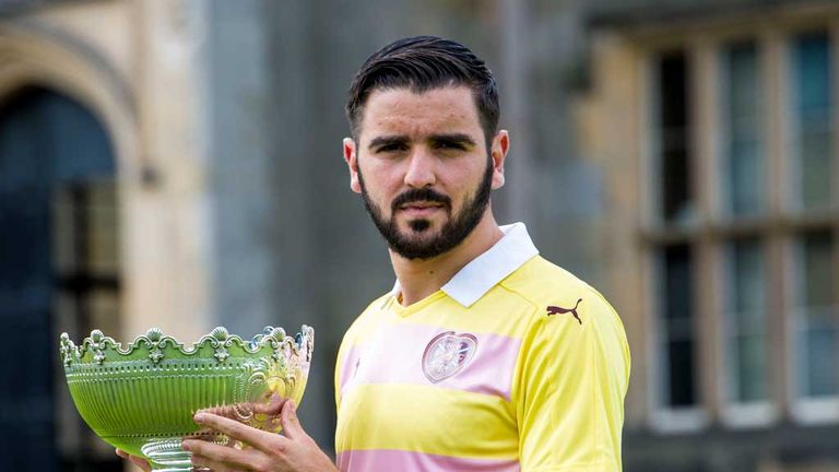 Hearts launch their new away kit; Alim Ozturk models whilst holding a quaich