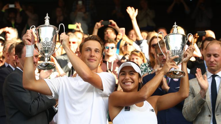 Heather Watson of Great Britain and Henri Kontinen of Finland lift their trophies