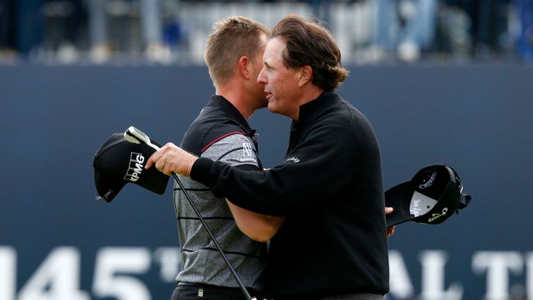 Sweden's Henrik Stenson (left) hugs USA's Phil Mickelson as he celebrates winning the Open Championship